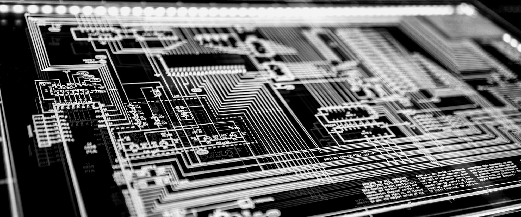 Fine circuit traces running across a board.